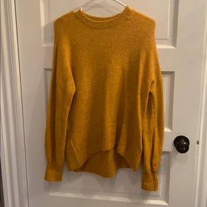 High to low yellow sweater